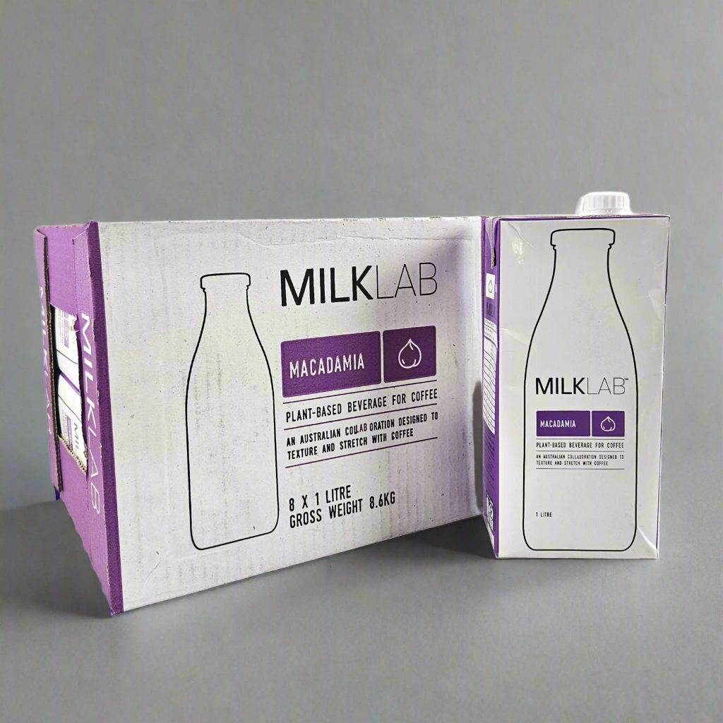 MilkLab macadamia plant-based beverage carton on a gray background